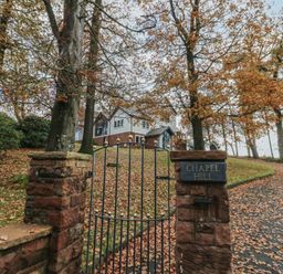 A gate with a sign at the entrance of a property at Chapel Hill in Catlowdy