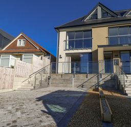 A house with stairs and outdoor area at Seafern House 36B Poole