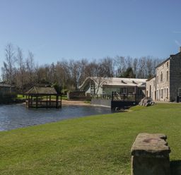 An outdoor area with a gazebo and buildings at Bluebell Lodge in Warton