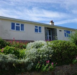 A house with garden and flowers at Badgers Cliff in Polzeath