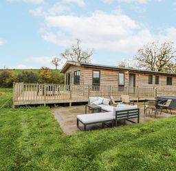 An outdoor patio area with seating at Willow Lodge in Admaston near Abbots Bromley