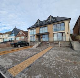 A house with balconies and driveway at Sea Fern House - 36 Poole