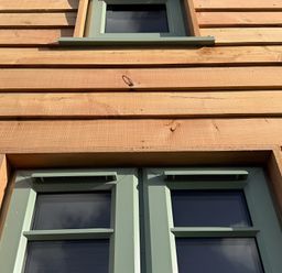 Windows with wooden wall at Y Nyth in 