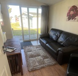 A living room with a sofa and coffee table at Embury