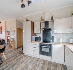 A kitchen with cabinets and appliances at 311 in Bridlington