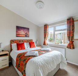 A bedroom with a bed and window at 311 Bridlington