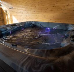 A hot tub with wooden walls at The Galloway in Morpeth