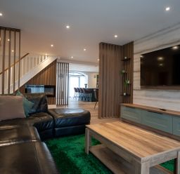 A living room with a sofa and coffee table at The Galloway in Morpeth