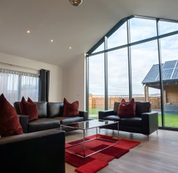 A living room with a sofa and coffee table at The Shearling in Morpeth