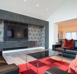 A living room with a television and coffee table at The Shearling in Morpeth