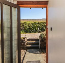 An entrance with a view of the garden at Tullythwaite Barn Kendal