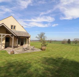 A house with patio furniture in the garden at Thimble Hill Near Armathwaite