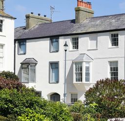 A house with windows and a garden at Tri Raglan Mawr in Beaumaris