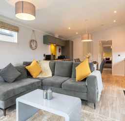 A living room with a sofa and coffee table at The Falls in Leyburn