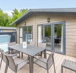 An outdoor dining area with a table and chairs at Wensleydale (Pet) Aysgarth