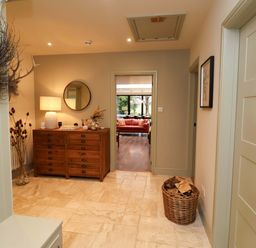 A hallway with a console table and a mirror at Fairview in Darsham