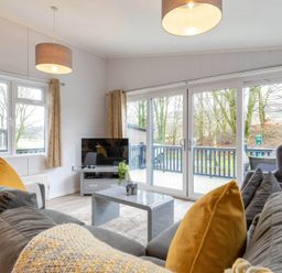 A living room with a sofa and television at The Falls (Pet) Leyburn
