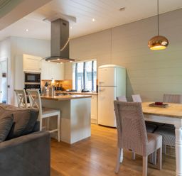 A kitchen with a table and chairs at Bainbridge in Leyburn