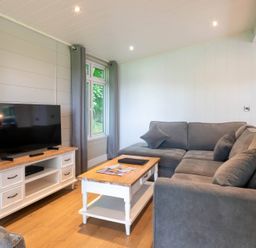 A living room with a television and a coffee table at Bainbridge in Leyburn