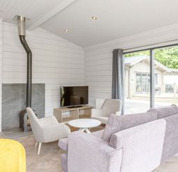 A living room with a sofa and television at Leyburn (Pet) Leyburn