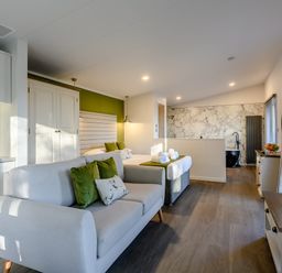 A bedroom with a kitchenette and a bed at Somersby Spa (Pet) Louth
