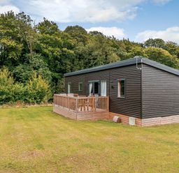 A cabin with a deck and windows at The Kinder Spa (Pet) Louth
