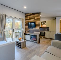 A living room with a television and sofa at Horncastle Spa Plus (Pet) in Louth