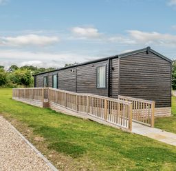 A cabin with a ramp and green grass at Alford WF in Louth