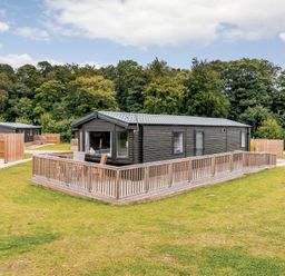 A lodge with decking and a garden area at Alford WF in Louth