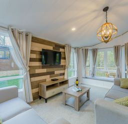 A living room with a sofa and coffee table at Brayford Lodge in Louth