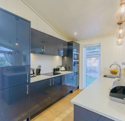 A kitchen with modern appliances and a fruit bowl at Retreat Lodge 4 in Louth