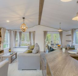 A living room with a sofa and coffee table at Brayford Lodge Spa (Pet) Louth