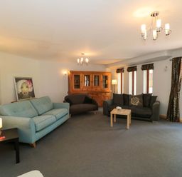 A living room with sofas and a coffee table at Lady Of Lourdes in Whitchurch, Herefordshire