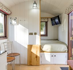 A bedroom with a bed and television at No 1 The Orchard, Upton Warren