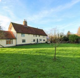 A house with a garden and grass at Town Farm in 