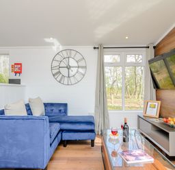 A living room with a sofa and coffee table at The Elton in Kings Cliffe