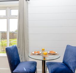 A dining room with a table and chairs at The Elton in Kings Cliffe