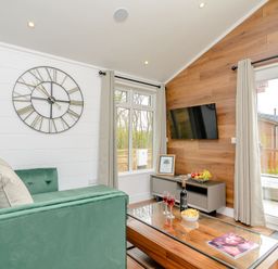 A living room with a sofa and coffee table at The Castor in Kings Cliffe
