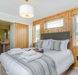 A bedroom with a bed and a sink at The Kingscliffe (Pet) in Kings Cliffe