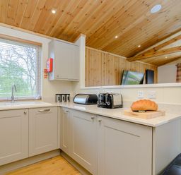 A kitchen with a sink and toaster at The Sutton in Kings Cliffe