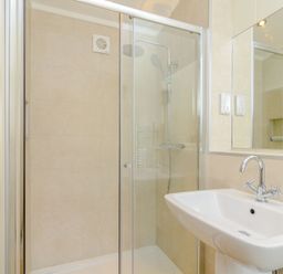 A bathroom with a shower and sink at The Chesterton in Kings Cliffe