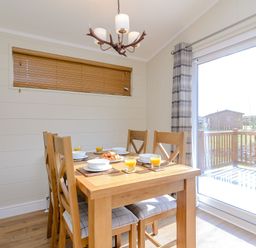 A dining room with a table and chairs at The Chesterton (Pet) in Kings Cliffe