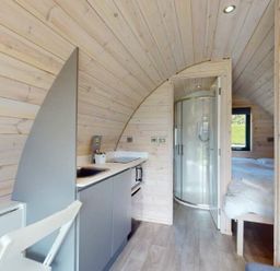 A studio with a kitchen unit and shower at Pod 1 (Pet Friendly) Carnforth