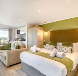 A studio with a bed and kitchenette at Pear Tree Spa (Pet) Carlton Miniott near Thirsk