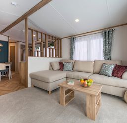 A living room with a sofa and coffee table at Ellery Waterside Spa Carlton Miniott near Thirsk