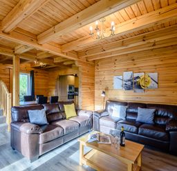 A living room with sofas and a coffee table at Birch Waterside Spa Carlton Miniott near Thirsk