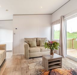 A living room with sofas and a coffee table at Kinder Spa near Carlton Miniott Thirsk
