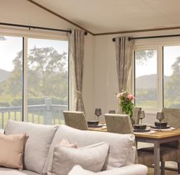 A dining room with a table set for meals at Laurel Spa Carlton Miniott near Thirsk
