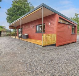 A cabin with a patio in front at Killinure Cottage, Glasson, County Westmeath