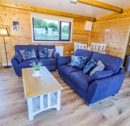 A living room with sofas and a coffee table at Killinure Cottage in Glasson, County Westmeath